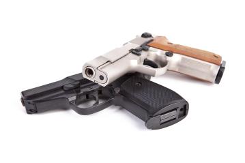 Two guns on white background- Stock Photo or Stock Video of rcfotostock | RC Photo Stock