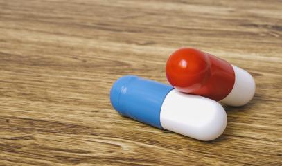 two medical capsules on a table- Stock Photo or Stock Video of rcfotostock | RC Photo Stock