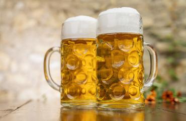 Two mugs of beer with foam stand on the table - Stock Photo or Stock Video of rcfotostock | RC Photo Stock