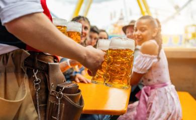 Waiter serving beer to happy friends at oktoberfest or dult festival to a table, amusement park rides in the sunny background : Stock Photo or Stock Video Download rcfotostock photos, images and assets rcfotostock | RC Photo Stock.: