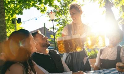 Waitress getting beer to patrons of beer garden or oktoberfest in Bavaria, Germany, : Stock Photo or Stock Video Download rcfotostock photos, images and assets rcfotostock | RC Photo Stock.: