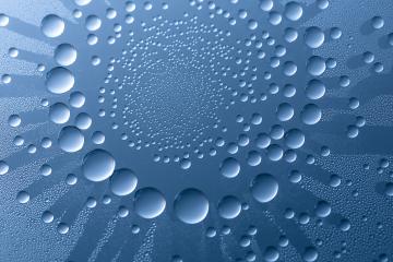 waterdrops in a circular rain effect lotus on blue background- Stock Photo or Stock Video of rcfotostock | RC Photo Stock