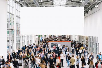 White illuminated advertising as a mock-up in the trade fair about many people : Stock Photo or Stock Video Download rcfotostock photos, images and assets rcfotostock | RC-Photo-Stock.: