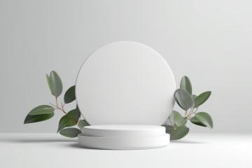 White round pedestal with green leaves on gray background- Stock Photo or Stock Video of rcfotostock | RC Photo Stock