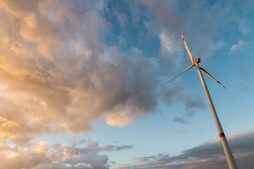 wind turbine against cloudy sunset sky- Stock Photo or Stock Video of rcfotostock | RC Photo Stock
