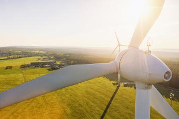 Wind turbines and agricultural fields on a summer day - Energy Production with clean and Renewable Energy - aerial shot- Stock Photo or Stock Video of rcfotostock | RC Photo Stock