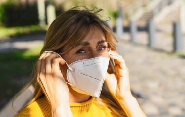Woman at bench put on a medical anti virus protection knN95 FFP2 face mask to prevent others from corona virus COVID-19 and SARS cov 2 infection at the city at spring  Woman using protective face mask- Stock Photo or Stock Video of rcfotostock | RC Photo Stock