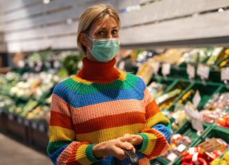 Woman at supermarket in the fruit section wearing an anti virus protection mask due to covid-19  Coronavirus pandemic - Stock Photo or Stock Video of rcfotostock | RC Photo Stock
