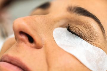 Woman gets prepared for long Eyelashes at cosmetology salon. Las- Stock Photo or Stock Video of rcfotostock | RC Photo Stock
