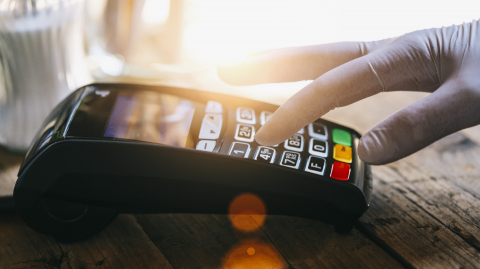 Woman hand with medical latex protective gloves enters PIN code on payment terminal in a bar. Protection for Coronavirus COVID-19. - Stock Photo or Stock Video of rcfotostock | RC Photo Stock
