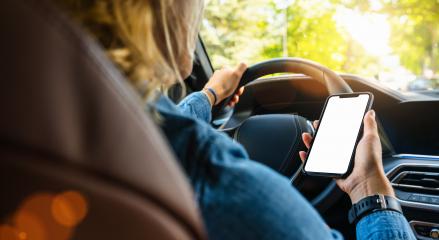 Woman holding black mobile phone in hands with blank desktop screen while car driving at summer in the city, Mockup image- Stock Photo or Stock Video of rcfotostock | RC Photo Stock