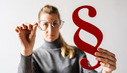 Woman Holding red Paragraph sign and glasses. Law, lawyer and Justice Paragraph Symbol- Stock Photo or Stock Video of rcfotostock | RC-Photo-Stock