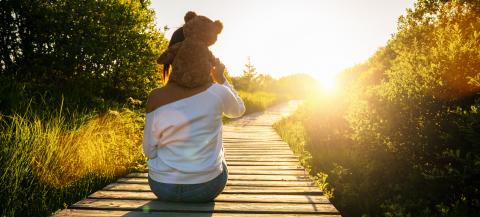 Woman holding teddy bear toy on his shoulders at sunset, copyspace for your individual text.- Stock Photo or Stock Video of rcfotostock | RC-Photo-Stock