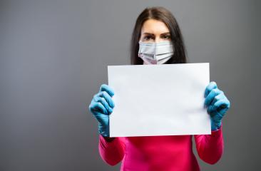 woman in medical mask and gloves showing empty blank paper as sign of protest in her hands. Focus on a piece of paper. prevent others from corona COVID-19 and SARS cov 2 infection, copy space- Stock Photo or Stock Video of rcfotostock | RC-Photo-Stock