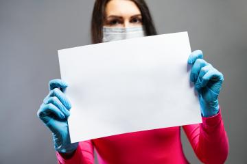 woman in medical mask and gloves showing empty blank paper in her hands. Focus on a piece of paper. prevent others from corona COVID-19 and SARS cov 2 infection, copy space for individual text- Stock Photo or Stock Video of rcfotostock | RC Photo Stock