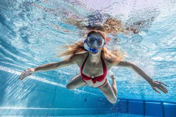 woman in snorkeling mask dive underwater in swimming pool of a Spa Hotel- Stock Photo or Stock Video of rcfotostock | RC Photo Stock