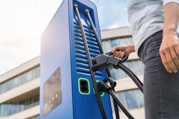 woman insert a DC - CCS type 2 EV charging connector at EV charg : Stock Photo or Stock Video Download rcfotostock photos, images and assets rcfotostock | RC Photo Stock.: