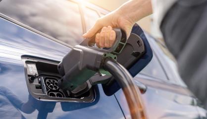 Woman inserting a DC CCS2 EV charging connector into electric ca : Stock Photo or Stock Video Download rcfotostock photos, images and assets rcfotostock | RC Photo Stock.: