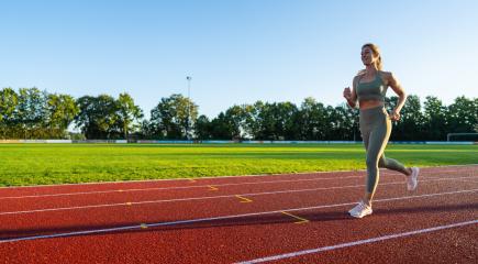 Woman jogging on a sunny running track : Stock Photo or Stock Video Download rcfotostock photos, images and assets rcfotostock | RC Photo Stock.: