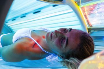 woman laying on solarium bed and get brown skin tone ready for summer- Stock Photo or Stock Video of rcfotostock | RC Photo Stock