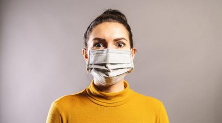 Woman looks scared wearing protection face mask against coronavirus outbreak COVID-19.  : Stock Photo or Stock Video Download rcfotostock photos, images and assets rcfotostock | RC Photo Stock.: