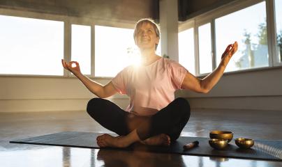 Woman meditating in gym with singing bowls, sunlight, peaceful yoga practice : Stock Photo or Stock Video Download rcfotostock photos, images and assets rcfotostock | RC Photo Stock.: