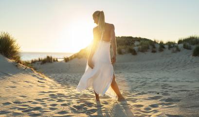 woman stands barefoot through sand dunes towards to sea at summer sunset : Stock Photo or Stock Video Download rcfotostock photos, images and assets rcfotostock | RC Photo Stock.:
