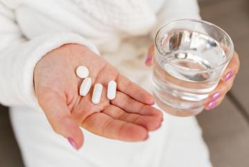 woman taking in medical pills with water glass. Health care and medical concept.- Stock Photo or Stock Video of rcfotostock | RC Photo Stock