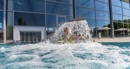 woman under a waterfall faucet in a spa swimming-pool- Stock Photo or Stock Video of rcfotostock | RC Photo Stock