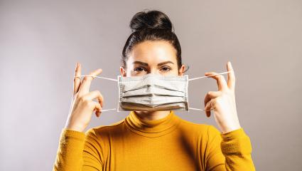 Woman wearing an anti virus protection mask to prevent others from corona COVID-19 and SARS cov 2 infection- Stock Photo or Stock Video of rcfotostock | RC Photo Stock