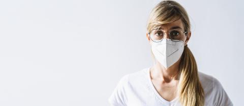 Woman wearing N95 FFP2 an anti virus protection mask to prevent others from corona COVID-19 and SARS cov 2 infection, with copy space for individual text- Stock Photo or Stock Video of rcfotostock | RC Photo Stock
