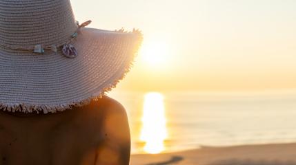 woman with straw hat relaxing at beach on sunset, Summer beach vacation concept image- Stock Photo or Stock Video of rcfotostock | RC-Photo-Stock