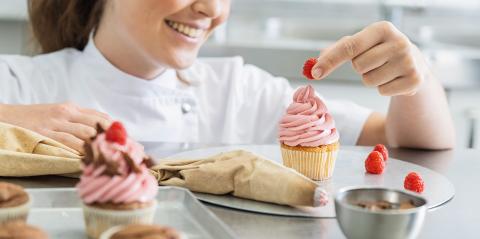Women in pastry bakery working on muffins putting a raspberry on top  : Stock Photo or Stock Video Download rcfotostock photos, images and assets rcfotostock | RC Photo Stock.: