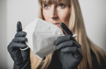 young, blond beautiful woman puts ffp2 protective mask on with protective medical gloves for protection against corona : Stock Photo or Stock Video Download rcfotostock photos, images and assets rcfotostock | RC Photo Stock.: