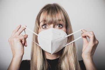 young, blond beautiful woman puts ffp2 protective mask on with protective medical gloves for protection against corona : Stock Photo or Stock Video Download rcfotostock photos, images and assets rcfotostock | RC Photo Stock.: