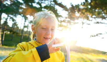 young child holding and play with wind turbine model at sunset at the beach forest. New Energy Production with clean and Renewable Energy concept image : Stock Photo or Stock Video Download rcfotostock photos, images and assets rcfotostock | RC Photo Stock.: