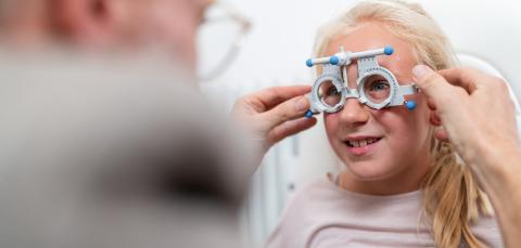 Young girl getting her eyesight tested with Optical measuring gl- Stock Photo or Stock Video of rcfotostock | RC Photo Stock