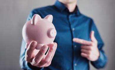 Young man holding a piggy bank : Stock Photo or Stock Video Download rcfotostock photos, images and assets rcfotostock | RC Photo Stock.: