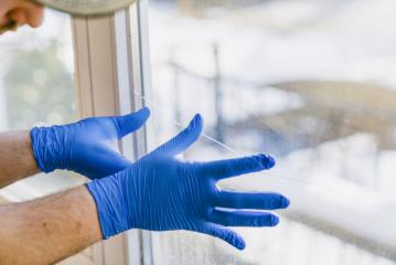 young man is using a rag and squeegee while cleaning windows. : Stock Photo or Stock Video Download rcfotostock photos, images and assets rcfotostock | RC Photo Stock.: