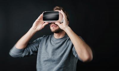 young man wearing Virtual Reality goggles VR Headset on black background- Stock Photo or Stock Video of rcfotostock | RC Photo Stock