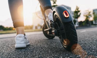 young woman on the electric scooter on the road at sunset : Stock Photo or Stock Video Download rcfotostock photos, images and assets rcfotostock | RC Photo Stock.: