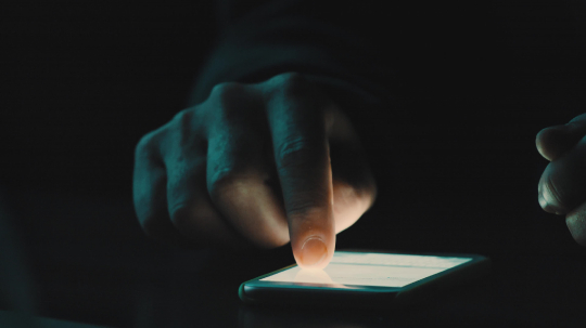 close up of person uses his smartphone at night. low light shot- Stock Photo or Stock Video of rcfotostock | RC-Photo-Stock