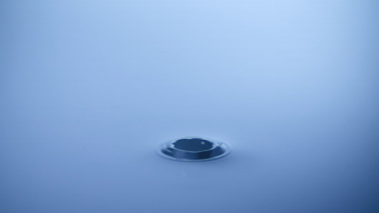 slow motion shot of drop of water falling on water surface - Stock Photo or Stock Video of rcfotostock | RC-Photo-Stock