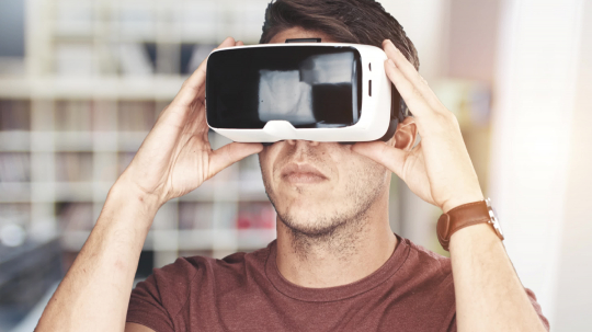 Young man wearing virtual reality googles / VR Glasses in home office- Stock Photo or Stock Video of rcfotostock | RC Photo Stock