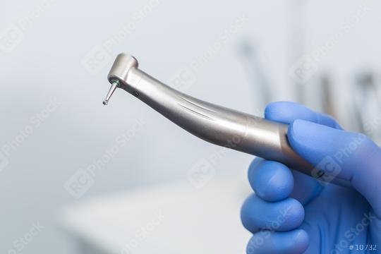  female dentist hand holding a dentist drill  : Stock Photo or Stock Video Download rcfotostock photos, images and assets rcfotostock | RC Photo Stock.: