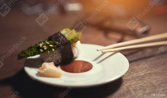 24746727-sashimi-sushi-roll-with-avocado-on-ceramic-plate-with  : Stock Photo or Stock Video Download rcfotostock photos, images and assets rcfotostock | RC Photo Stock.: