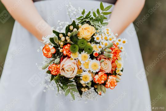 A bride with white dress is holing a wedding colorful bouquet of orange, yellow and green flowers. Close up. Wedding day.  : Stock Photo or Stock Video Download rcfotostock photos, images and assets rcfotostock | RC Photo Stock.: