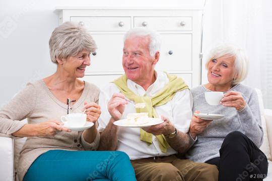 A cheerful group of senior friends enjoying coffee and cake together in a bright and cozy living room, showcasing warmth, friendship, and a relaxed social gathering  : Stock Photo or Stock Video Download rcfotostock photos, images and assets rcfotostock | RC Photo Stock.: