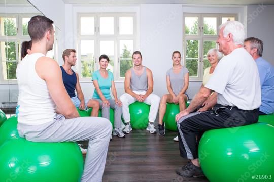 A fitness group of mixed ages sitting on green exercise balls in a bright gym, smiling and engaging in a light workout session, fostering teamwork, health, and community  : Stock Photo or Stock Video Download rcfotostock photos, images and assets rcfotostock | RC Photo Stock.: