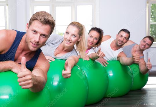 A group of people smiling and giving thumbs up while lying on green exercise balls in a fitness studio with bright windows
  : Stock Photo or Stock Video Download rcfotostock photos, images and assets rcfotostock | RC Photo Stock.: